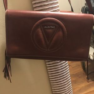 Maroon Valentino tassel bag with removable strap